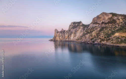 Pastel and picturesque landscape on a mountain reflecting the sea in the morning light. Beauty of nature concept. Soft colors of the morning dawn. Crimea. 