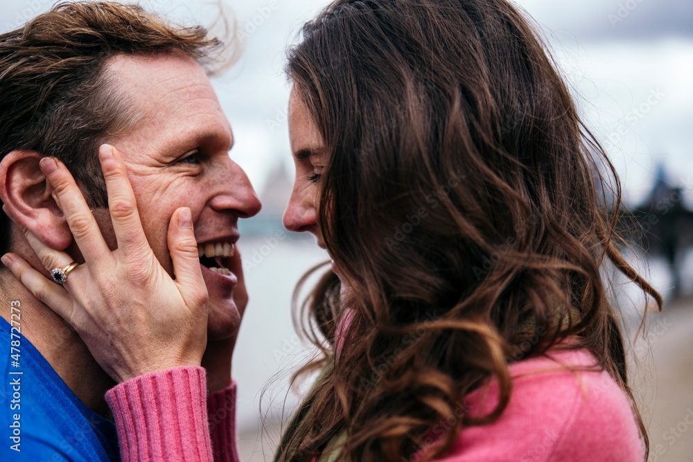 Affectionate couple with face to face laughing together Affectionate couple with face to face laughing together