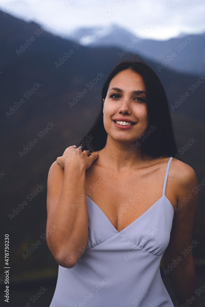 Beautiful smiling young woman in purple dress Beautiful smiling young woman in purple dress