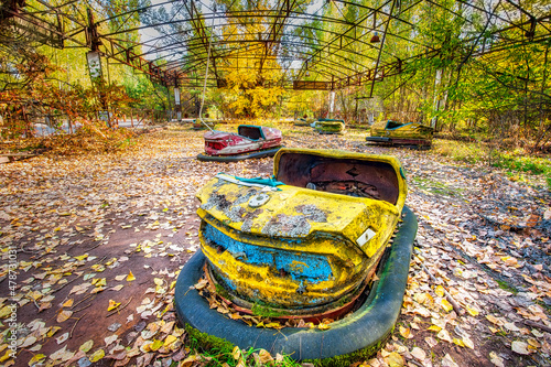 Ukraine, Kyiv Oblast, Pripyat, Abandoned bumper cars inPripyat Amusement Park photo