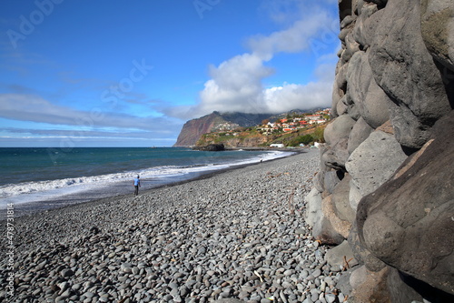 Formosa beach located near Camara de Lobos, Madeira Island, Portugal, with rock formations in the foreground