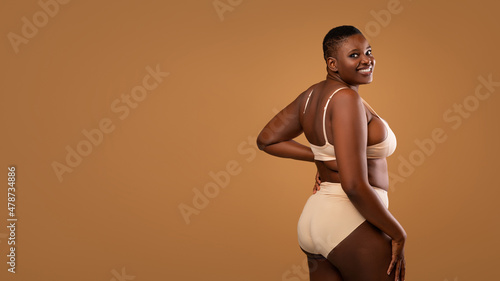 Portrait Of Curvy Smiling African American Woman In Lingerie, Banner photo