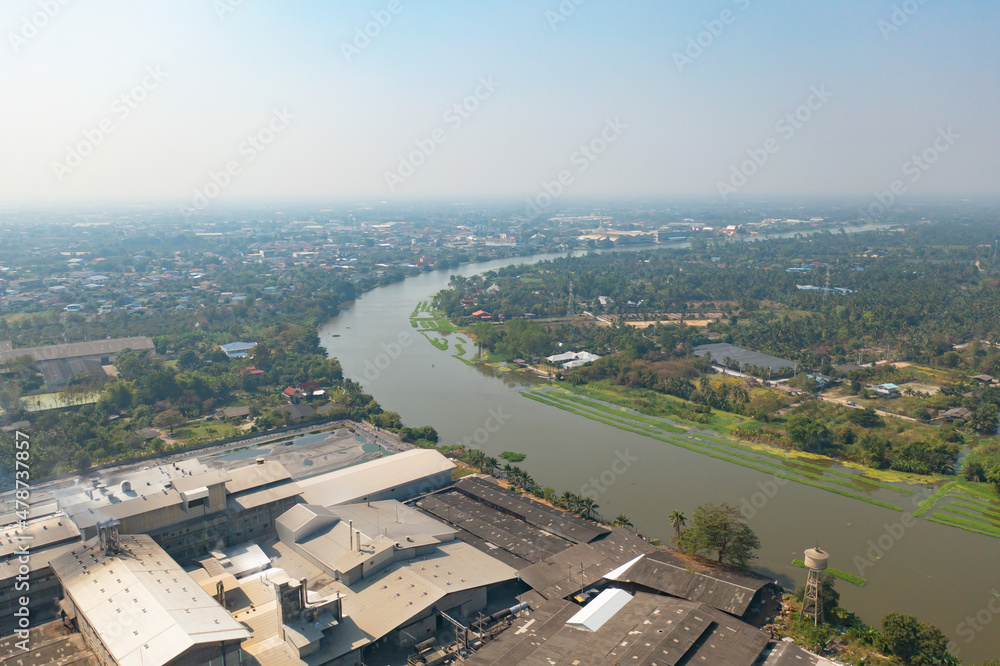 Aerial top view of curve of Chao Phraya River and forest trees and green mountain hills. Nature landscape background, Thailand.
