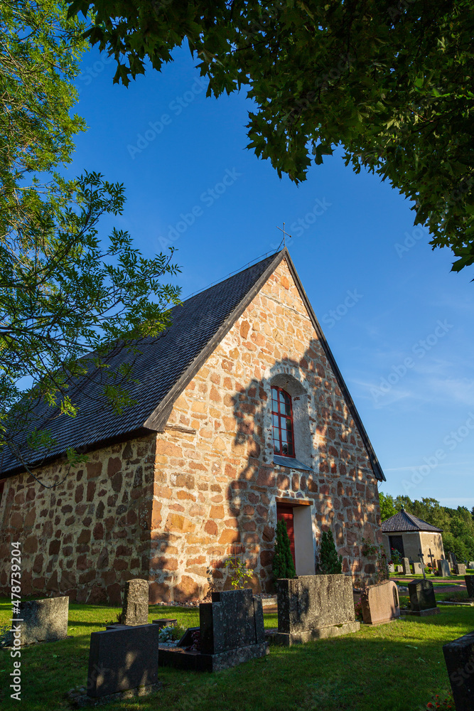 Geta church (Saint George's chapel church) and cemetery in Geta, Åland Islands, Finland, on a sunny day in the summer. It's believed to be built in the 1460's.