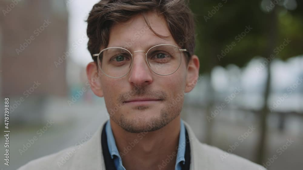 Mature caucasian man standing on city street with calm face Mature caucasian man standing on city street with calm face