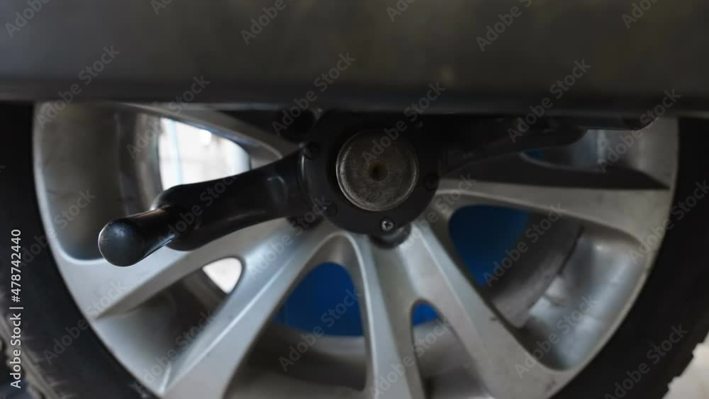 Closer look of the tire being fixed inside the auto shop in Estonia Closer look of the tire being fixed inside the auto shop in Estonia