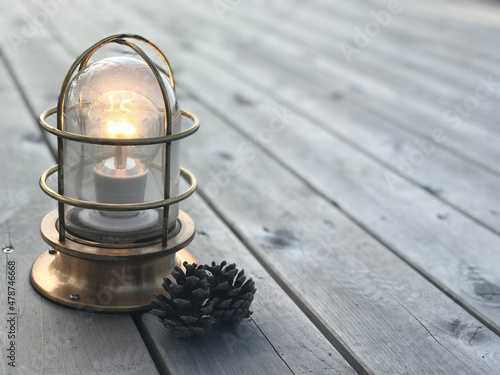 old oil lamp on wooden background