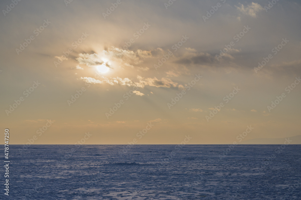 Frozen sea view at sunset.
