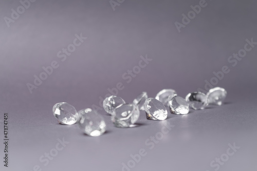 Diamonds out of Glas on a grey Background