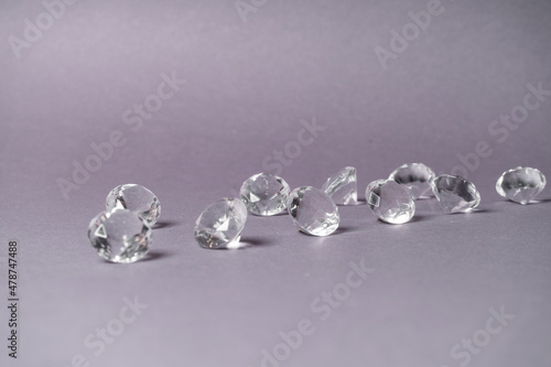 Diamonds out of Glas on a grey Background