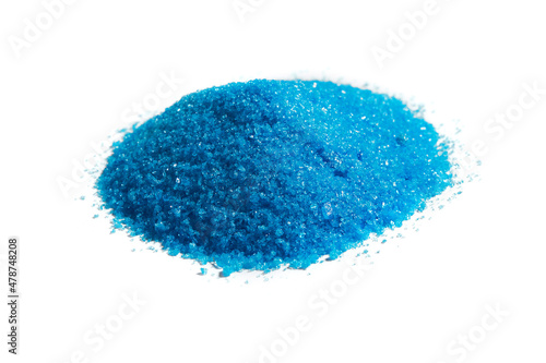 Cupric sulfate isolated on white. Bright, blue copper sulfate, CuSO4, also called blue vitriol or bluestone. Salt, used as algicide in swimming pools, for fireworks and in schools to grow crystals. photo