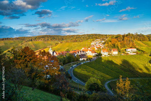 Germany  Stuttgart rotenberg city and church steeple between colorful vineyards landscape at sunset in autumn season
