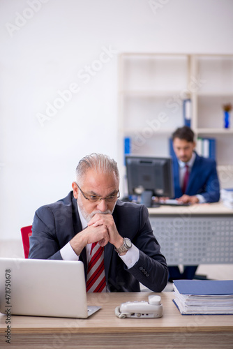 Two male colleagues working in the office