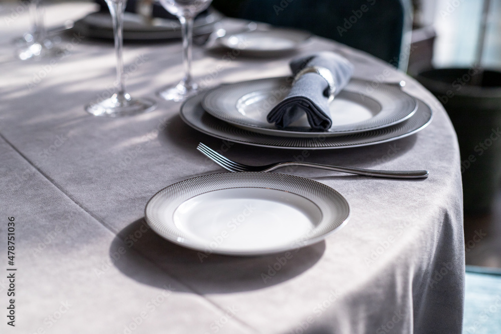 table serving with tablewear glasses and plates in restaurant. selected focus table serving with tablewear glasses and plates in restaurant. selected focus