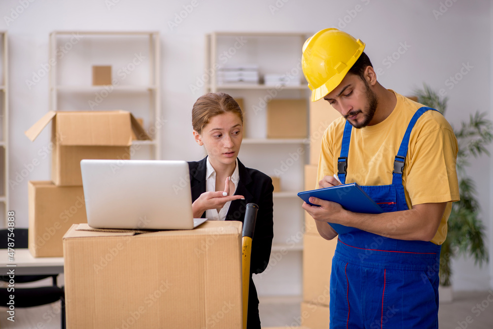 Young female boss and male contractor doing home relocation Young female boss and male contractor doing home relocation