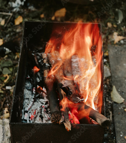 barbecue with fire. firewood burning brightly in the grill