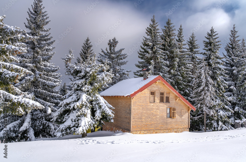 Winter house in mountain snow panoramic landscape at Christmas.
