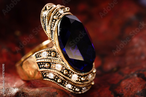 Close-up gold ring jewelry on leaf background.Vintage ring,ancient jewelry,used for vintage background