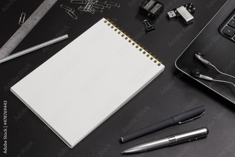 Office supplies on a black background. Workspace. flat lay Office supplies on a black background. Workspace. flat lay