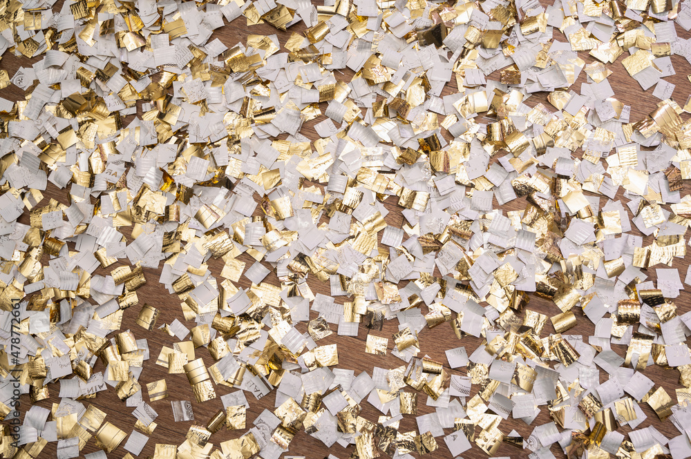 golden confetti spread after the holiday, new year, birthday, holiday background golden confetti spread after the holiday, new year, birthday, holiday background