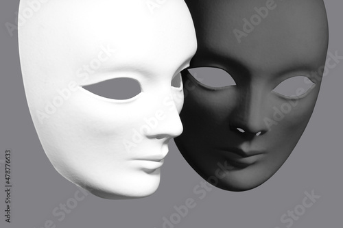 Two plaster Venetian masks on a gray background © Александр Евстафьев
