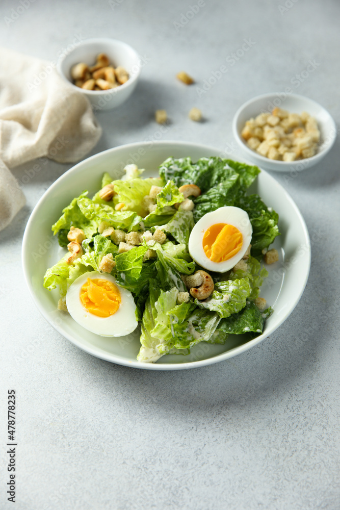 Healthy green salad with cashew and hard boiled eggs Healthy green salad with cashew and hard boiled eggs