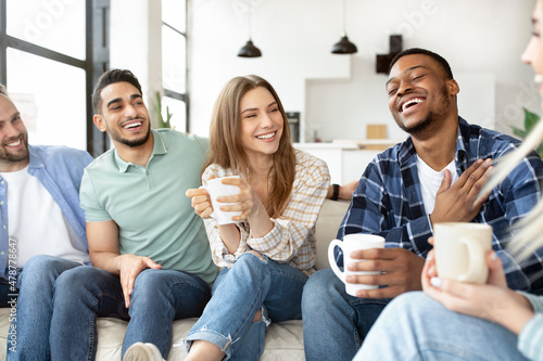 Photography Group of diverse friends spending time togeher on weekend, holding hot drinks, h