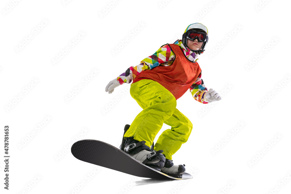 Obraz premium Portrait of young woman in bright sportswear, goggles and helmet snowboarding isolated on white studio background. Concept of winter sports