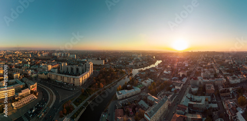 Sunny panoramic aerial view above river Lopan embankment with Skver Strilka in Kharkiv, Ukraine. Blue clear autumn cityscape, city streets