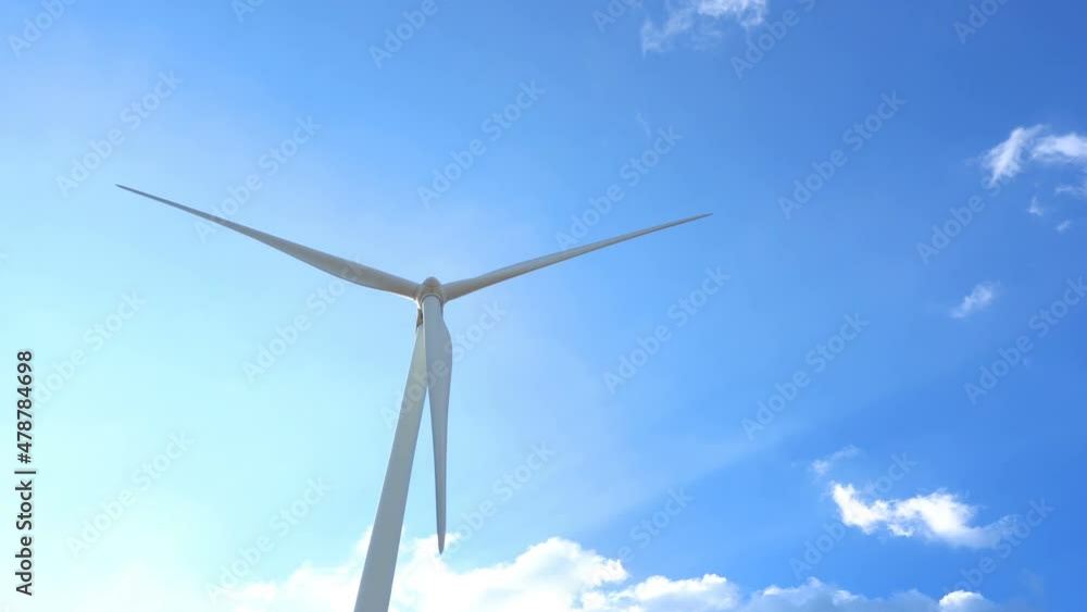 Wind turbine for generating electricity from wind power with beautiful sky and clouds