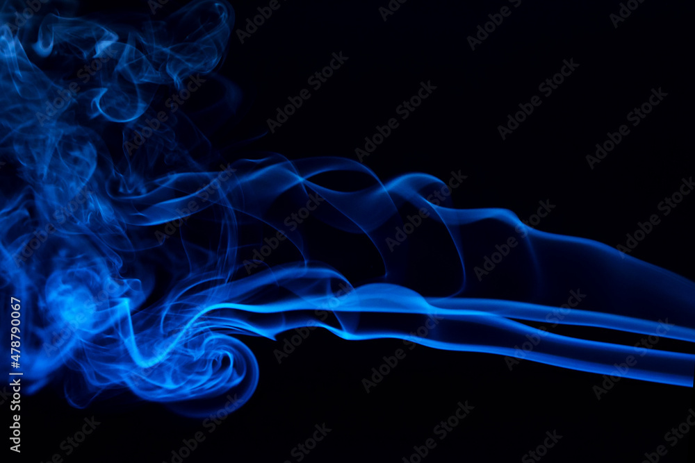 Fototapeta premium Abstract colored smoke hookah on dark background. Texture. Art Design element. Personal vaporizers fragrant steam. Concept of alternative non-nicotine smoking. E-cigarette. Blurry image, soft focus