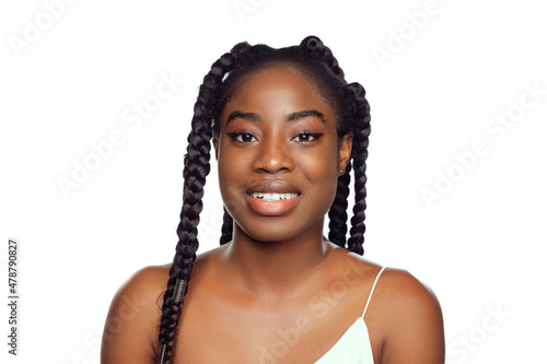 Close-up portrait of young beautiful dark skinned woman without makeup isolated over white studio background. Natural beauty concept.