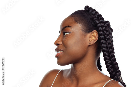 Adorable young african woman with well-kept skin isolated over white studio background. Natural beauty concept.