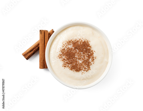 Delicious semolina pudding with cinnamon on white background, top view photo