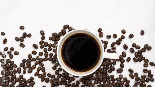top view coffee mug with coffee beans on blackground