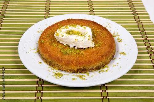 Turkish dessert with pistachio cream and cream, kunefe dessert photo