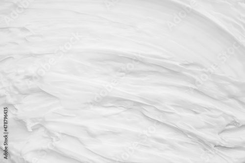 White surface of the cream lotion softens the background.