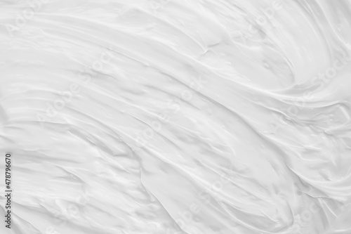 Fototapeta Naklejka Na Ścianę i Meble -  White surface of the cream lotion softens the background.