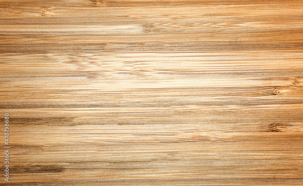Background with wood texture. Top view of a wooden table Brown treated wood with an abstract pattern. Bamboo. Background with wood texture. Top view of a wooden table Brown treated wood with an abstract pattern. Bamboo.