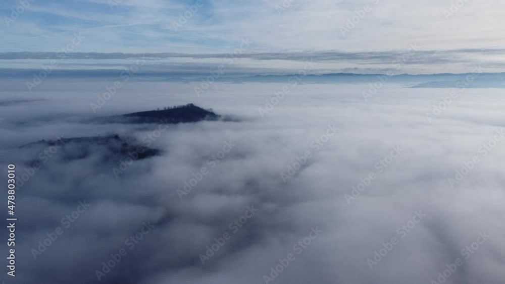 Flying to an island in a sea of clouds. Flying to an island in a sea of clouds.