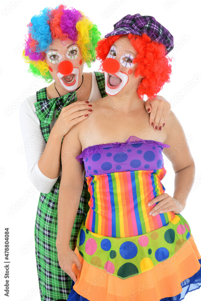 Funny clowns with red nose, costume and wig are laughing Funny clowns with red nose, costume and wig are laughing