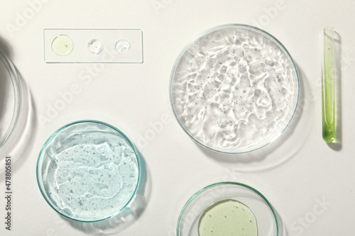 Cuadro en lienzo Flat lay composition with cosmetic gel and laboratory glassware on white backgro