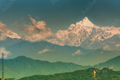 Beautiful view of Kanchenjunga mountain range with first daylight on it, at the background, morning light, at Sikkim, India © mitrarudra