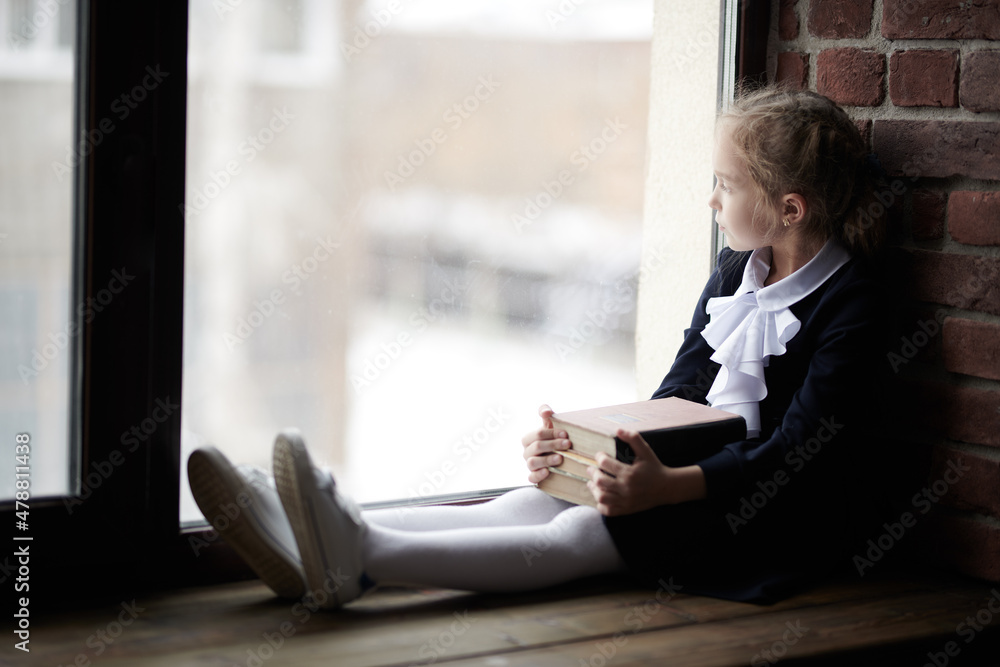 girl looking out the window