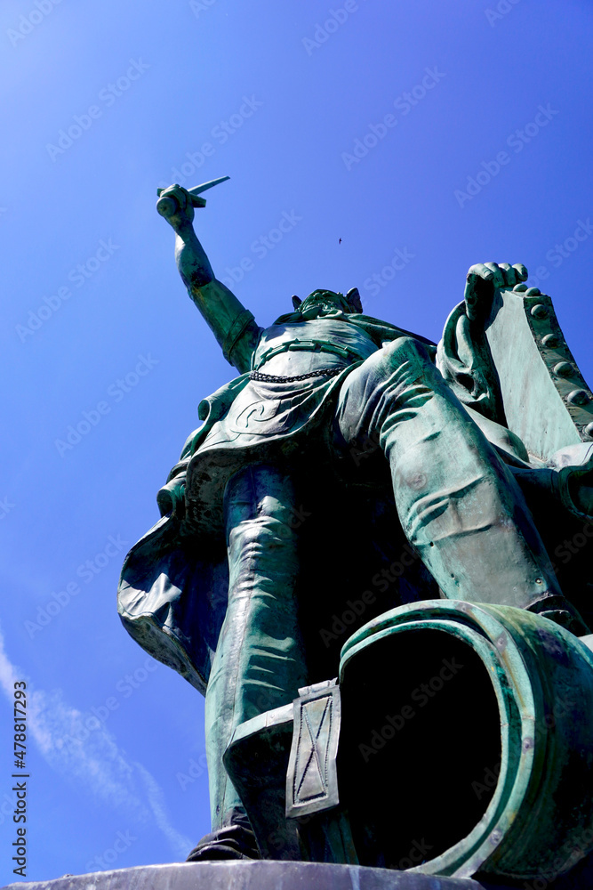 The Hermann Heights Monument is a statue erected in New Ulm, Minnesota. Herman or Hermann the German is the nickname of Arminius, leader German tribes over the Romans in 9AD. Copper statue with dome. The Hermann Heights Monument is a statue erected in New Ulm, Minnesota. Herman or Hermann the German is the nickname of Arminius, leader German tribes over the Romans in 9AD. Copper statue with dome.