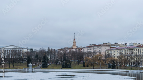 Dark waters of the river with thin plates of ice. The first ice on the river in center of Minsk.