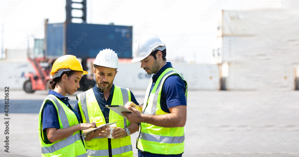 Ethnic diversity worker people, Success teamwork. Group of professional engineering people wearing hardhat safety helmet meeting and working with digital teblet. Ethnic diversity worker people, Success teamwork. Group of professional engineering people wearing hardhat safety helmet meeting and working with digital teblet.