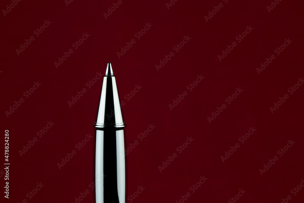 Upright Roller Ball Pen on a Red Background Upright Roller Ball Pen on a Red Background