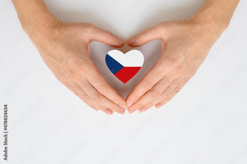 The national flag of the Czech Republic in female hands. The national flag of the Czech Republic in female hands.