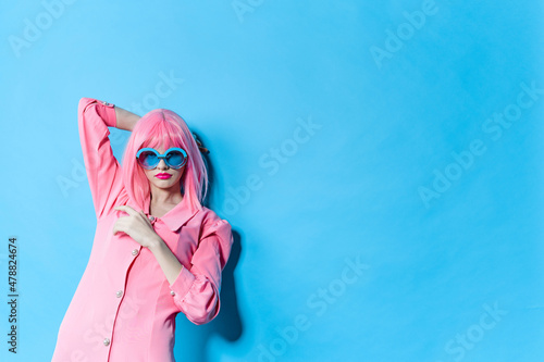 glamorous woman in pink wig pink dress Red lips studio model unaltered